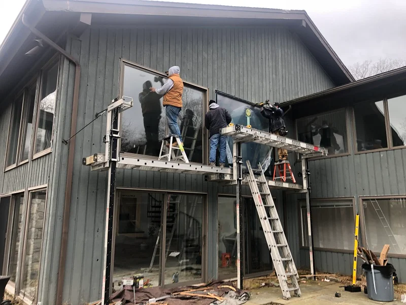 Scaffolding is needed to install these large Pella picture windows